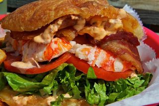 A close up of a lobster roll.