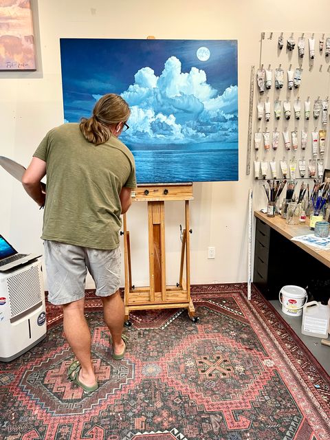 Hale applies finishing touches to his painting Atlantic Moon. 