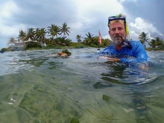 Chris Bergh snorkeling in the ocean.