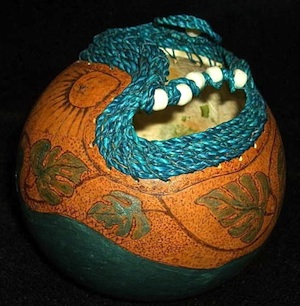 Susann's intriguing gourd creations might be colorfully painted, wood-burned and adorned with elements that range from woven seagrass to whimsical feathers.