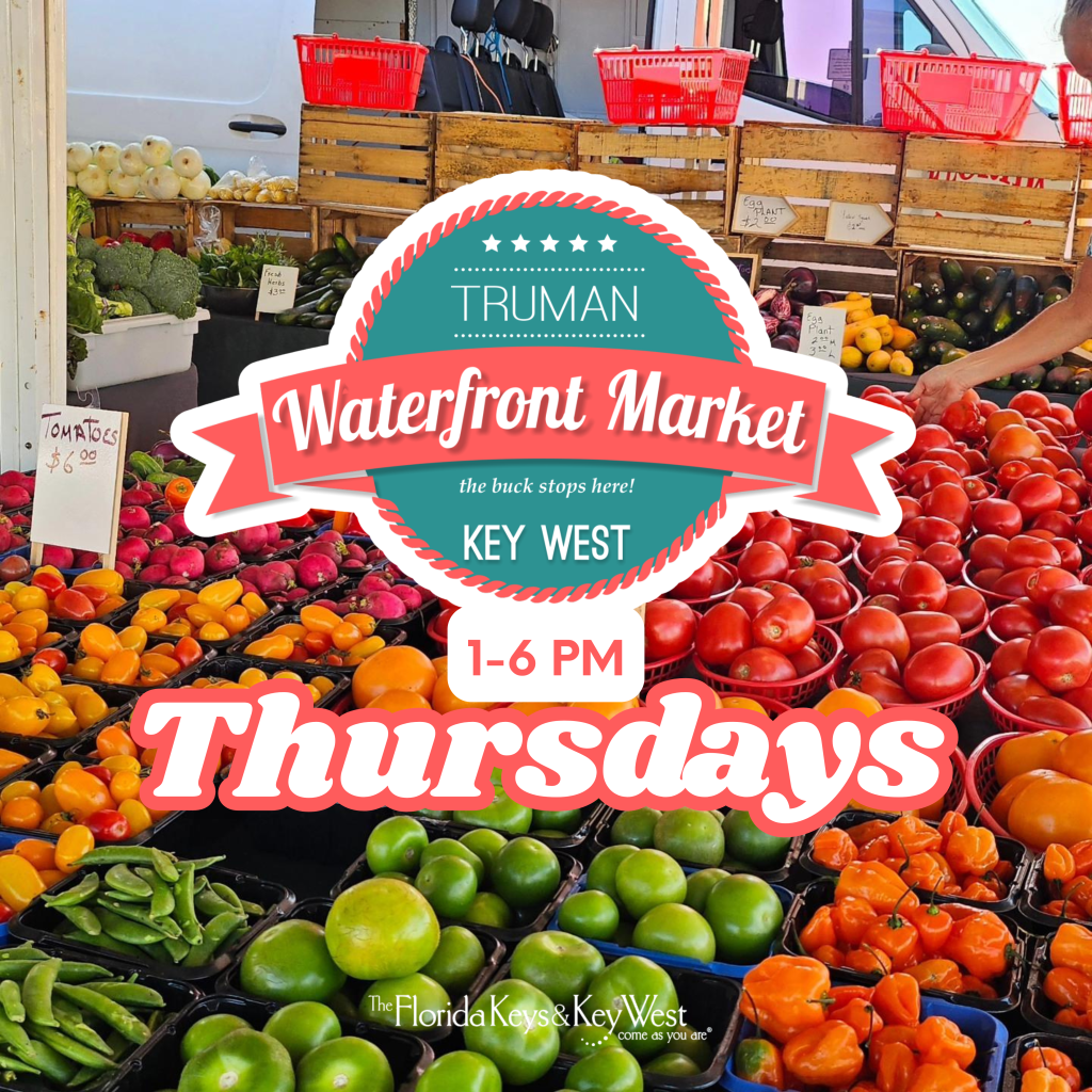 Market stand with colorful fruits and vegetables displayed in baskets.