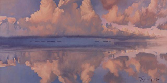 Pink clouds reflected on calm water at sunset.