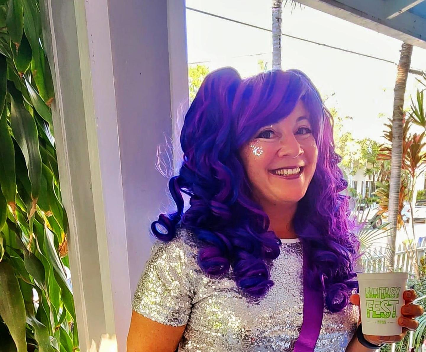 Nadine Grossman Orr with a purple wig and face glitter during Fantasy Fest in Key West