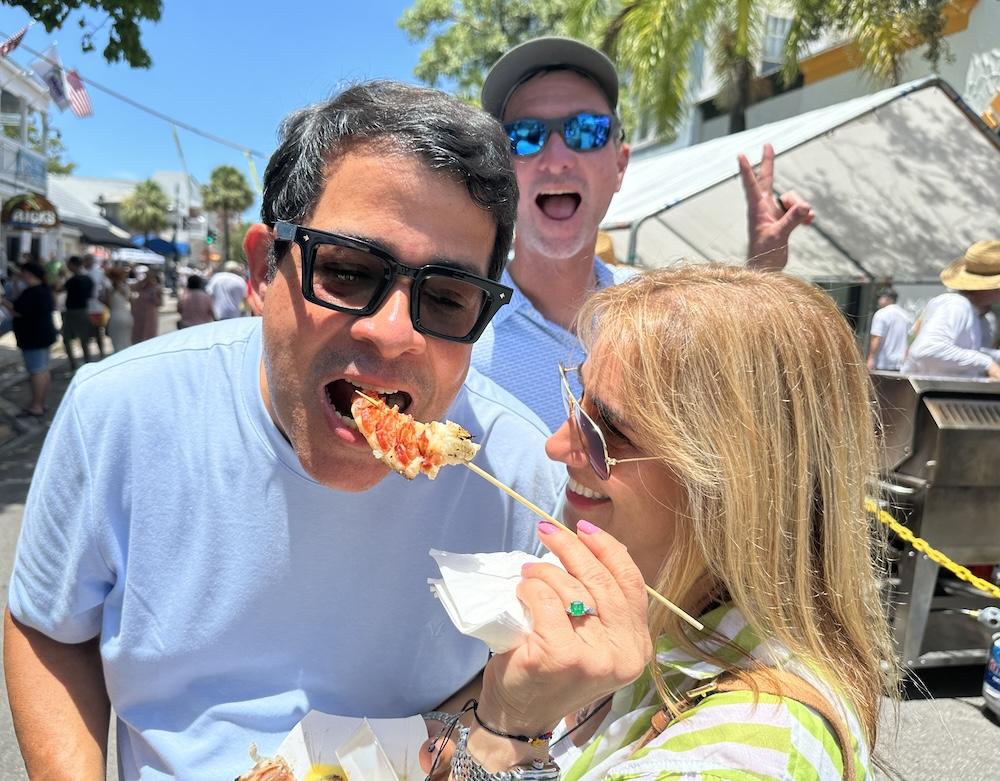 Woman feeding man Keys lobster
