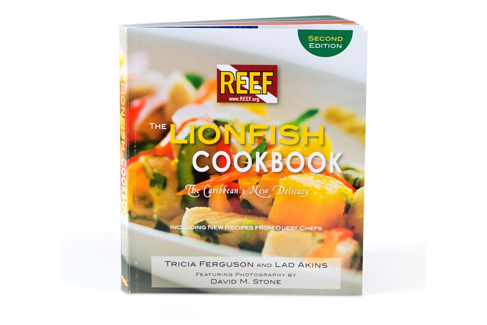 Lionfish cookbook with colorful seafood dish on cover.