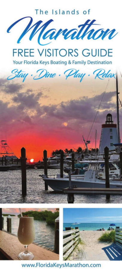 Sunset over a marina with a lighthouse, drink next to a pool, and a sandy beach path.