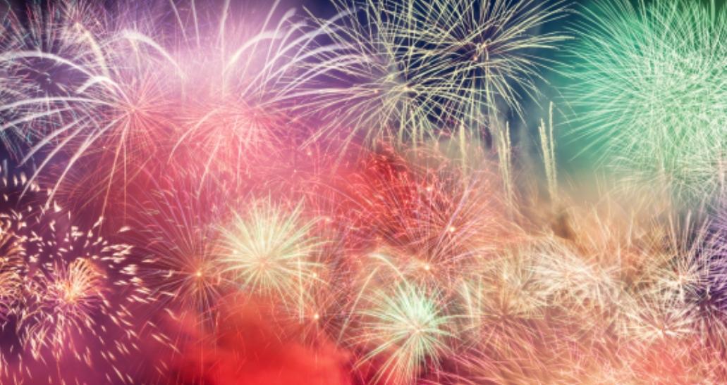 Colorful fireworks exploding in the night sky.