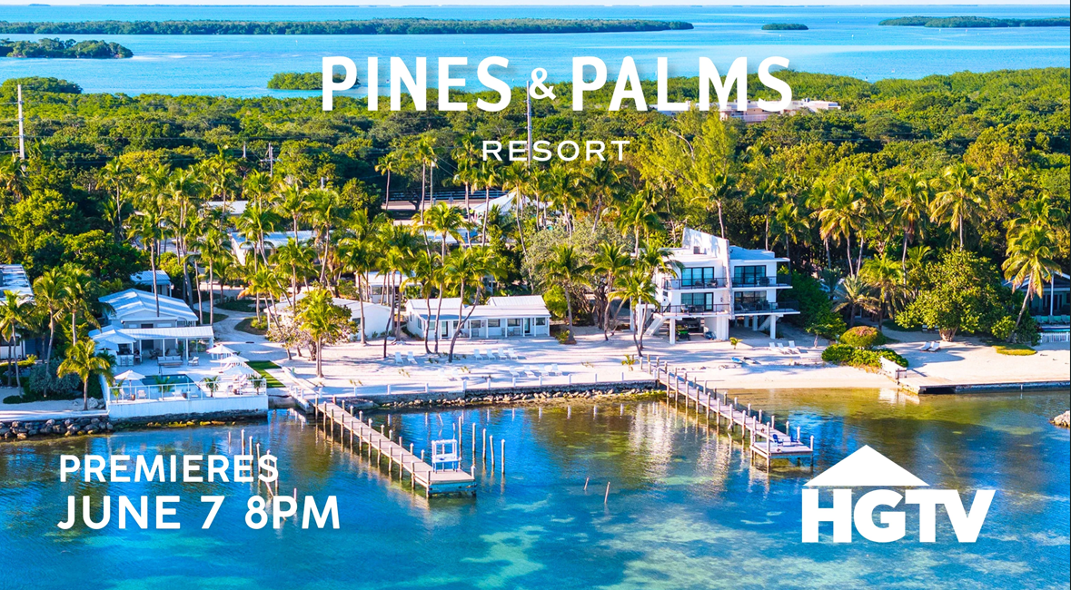 Tropical resort with palm trees, ocean view, and docks, labeled Pines &amp; Palms Resort.