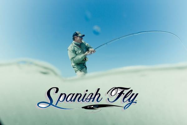 Man fishing under clear blue sky with "Spanish Fly" text below.