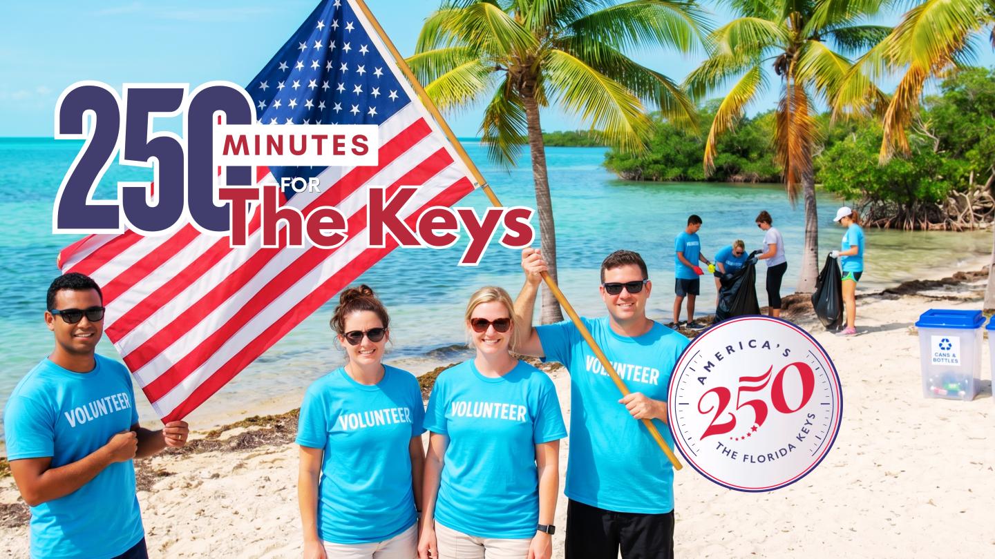 People in blue shirts on a tropical beach with American flag.