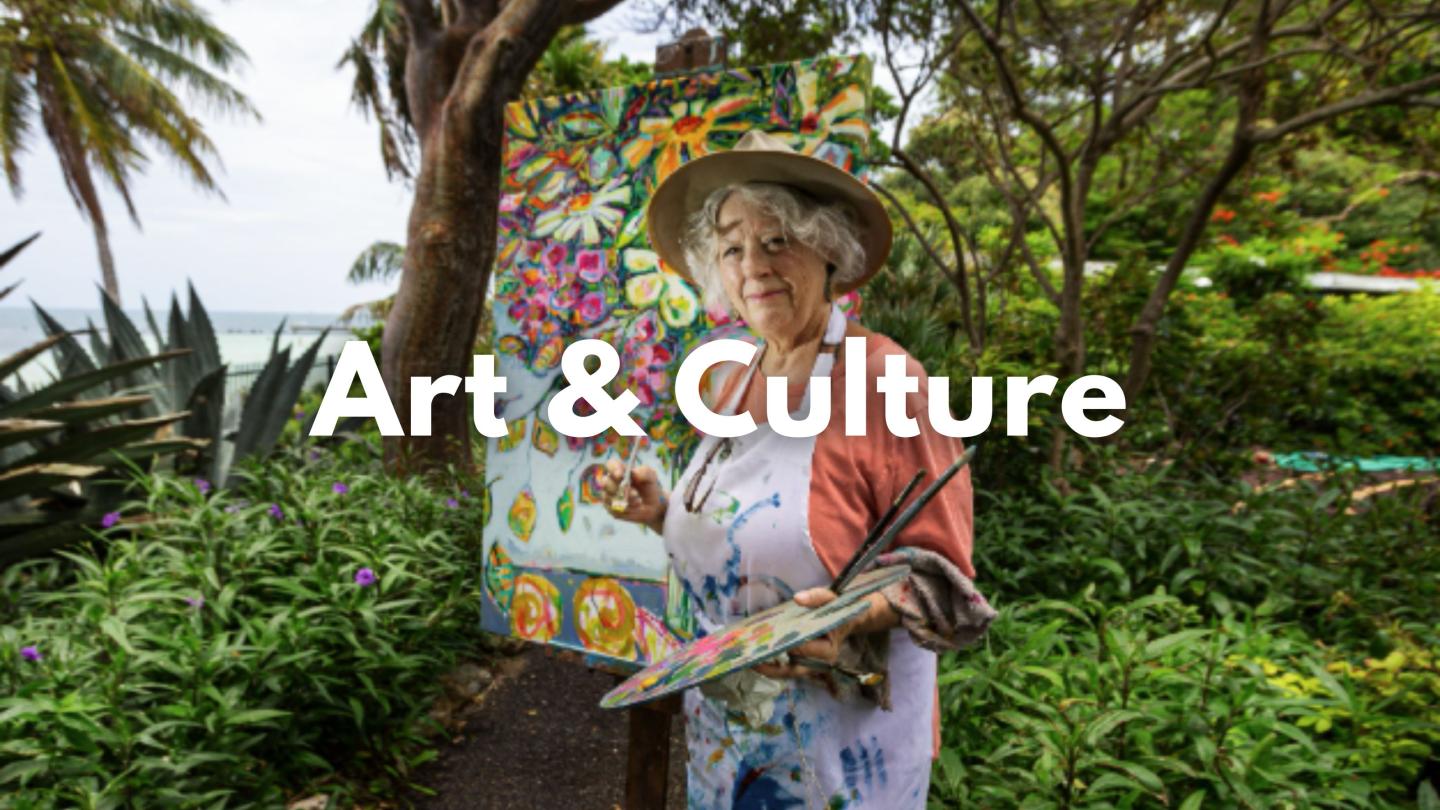 Elderly woman painting in a lush garden setting.
