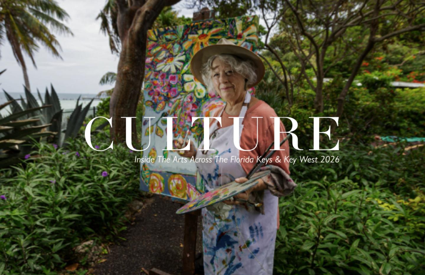 Woman in a floral dress and sunhat gardening in a lush tropical garden.