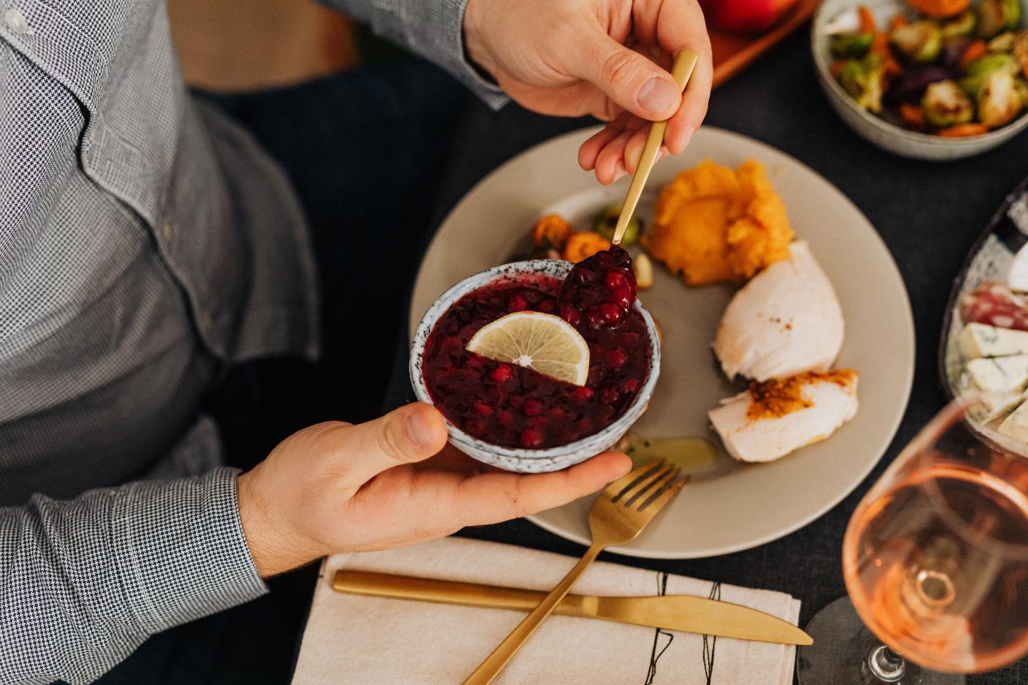 Overhead view of diner serving beet dish at a restaurant table.