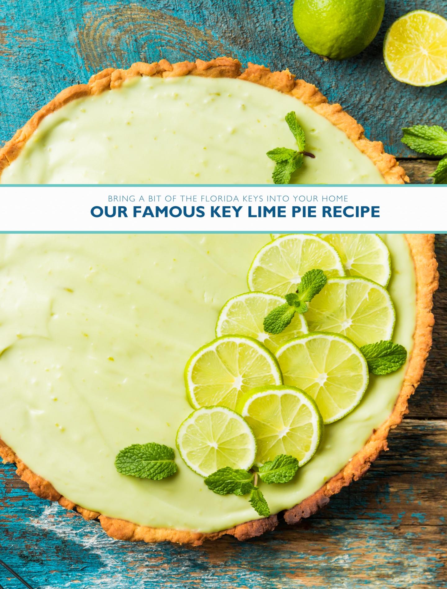 Key lime pie with lime slices and mint on a rustic blue table.