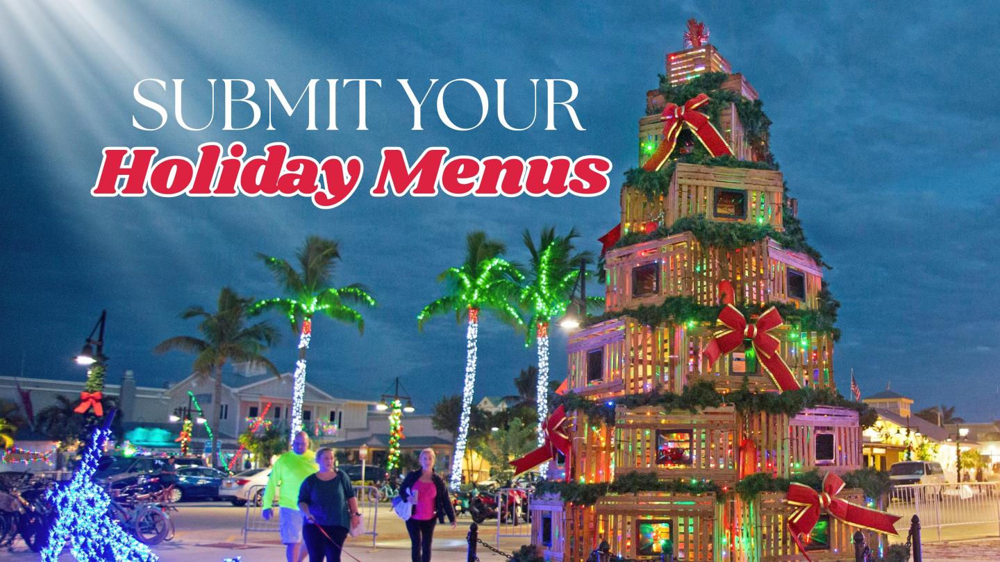 Festively lit Victorian house display with “Submit Your Holiday Menus” text.